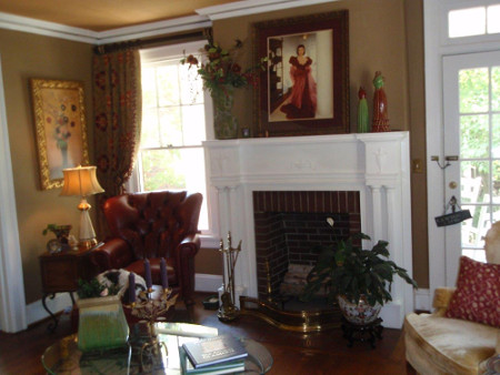 residential interior design red chair fireplace